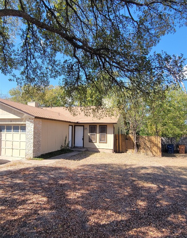 12802 Tomanet Trail, Unit B Austin, TX 78727 - Photo 1 of 23 front view of a house with a yard