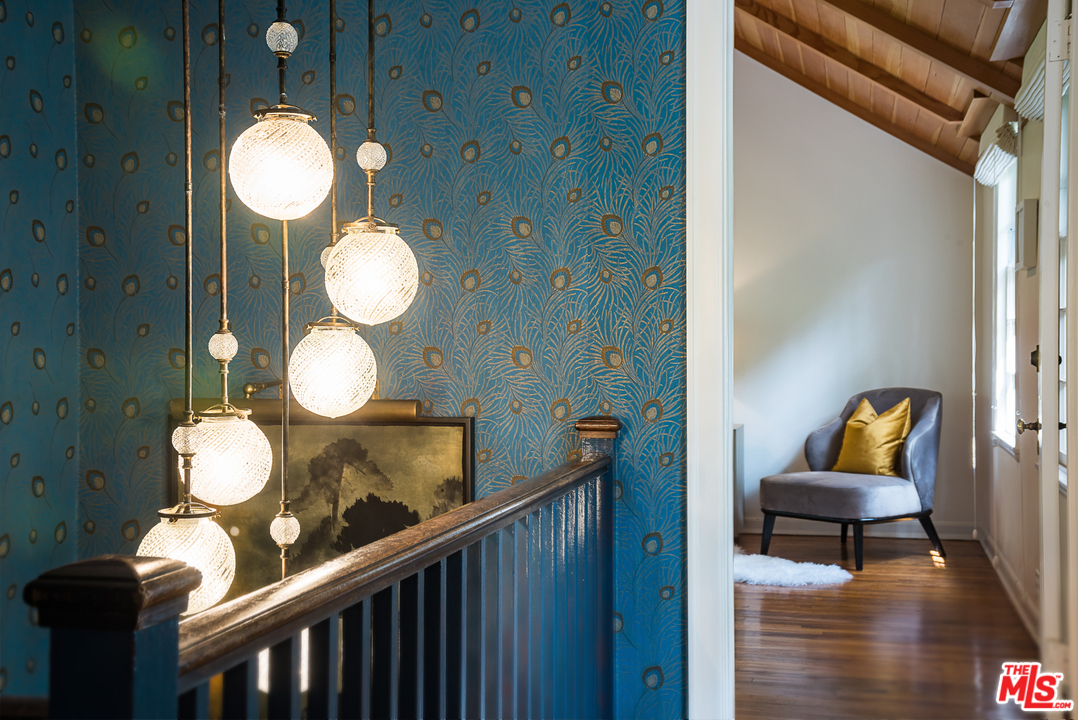 919 Rivas Canyon Road Pacific Palisades, CA 90272 - Photo 15 of 43 a view of a livingroom with furniture and wooden floor