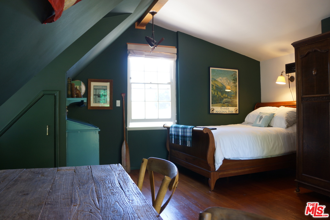919 Rivas Canyon Road Pacific Palisades, CA 90272 - Photo 21 of 43 a living room with furniture and a window
