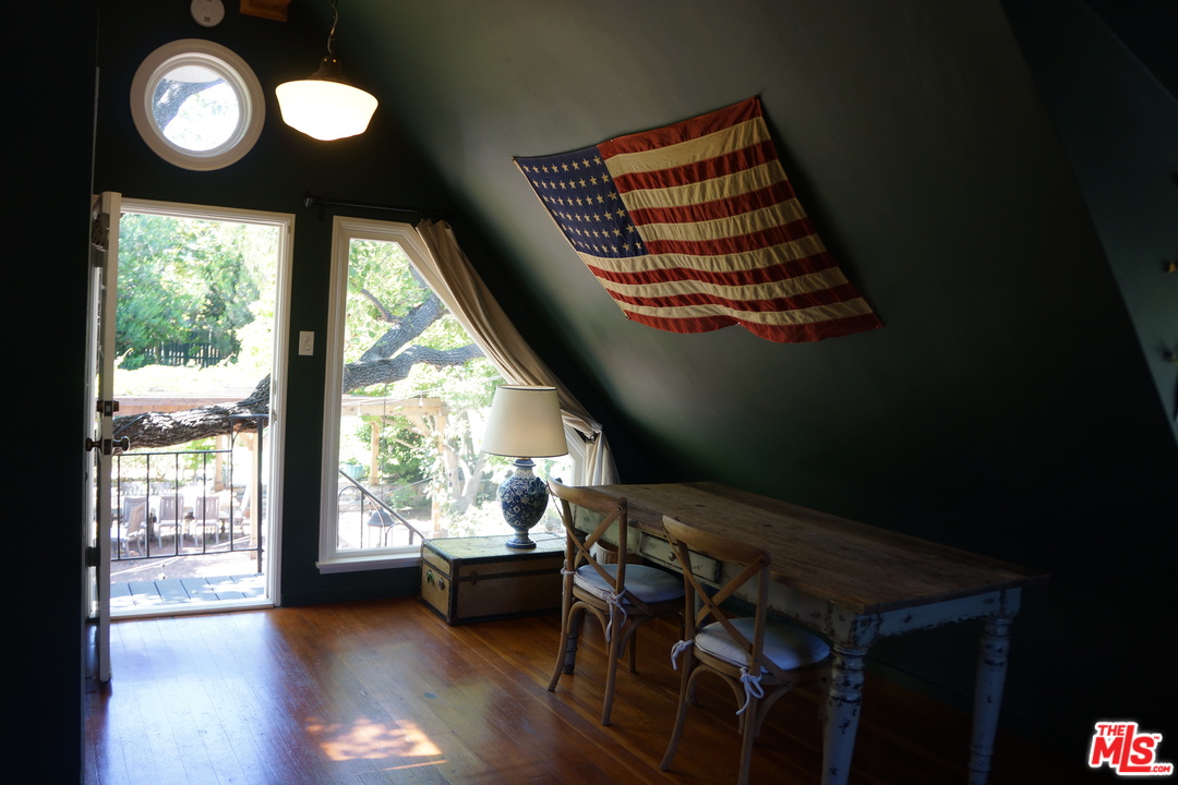 919 Rivas Canyon Road Pacific Palisades, CA 90272 - Photo 22 of 43 a view of a room with furniture and wooden floor