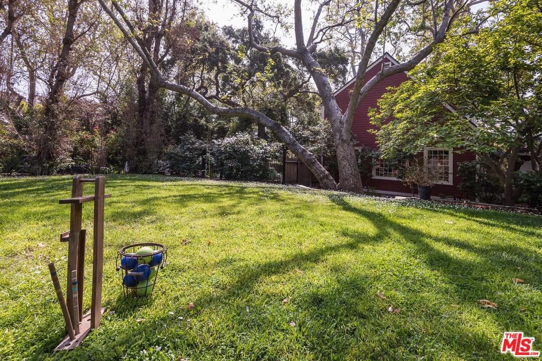919 Rivas Canyon Road Pacific Palisades, CA 90272 - Photo 34 of 43 a view of a swimming pool with an outdoor space and seating area