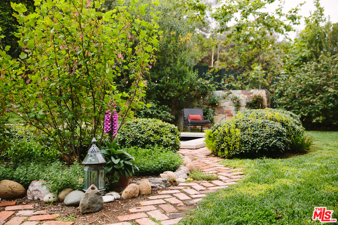919 Rivas Canyon Road Pacific Palisades, CA 90272 - Photo 37 of 43 a bunch of flowers sitting in the yard