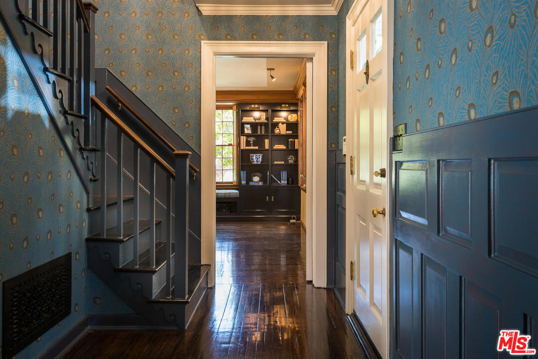 919 Rivas Canyon Road Pacific Palisades, CA 90272 - Photo 5 of 43 a view of hallway with wooden floor