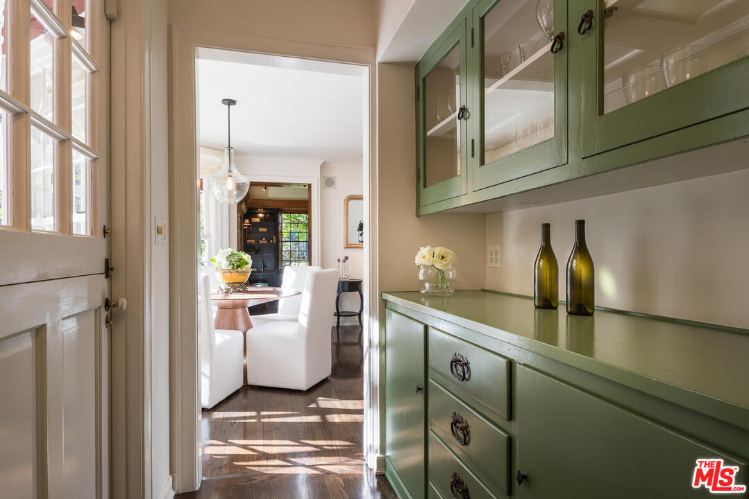 919 Rivas Canyon Road Pacific Palisades, CA 90272 - Photo 8 of 43 a kitchen with cabinets and window