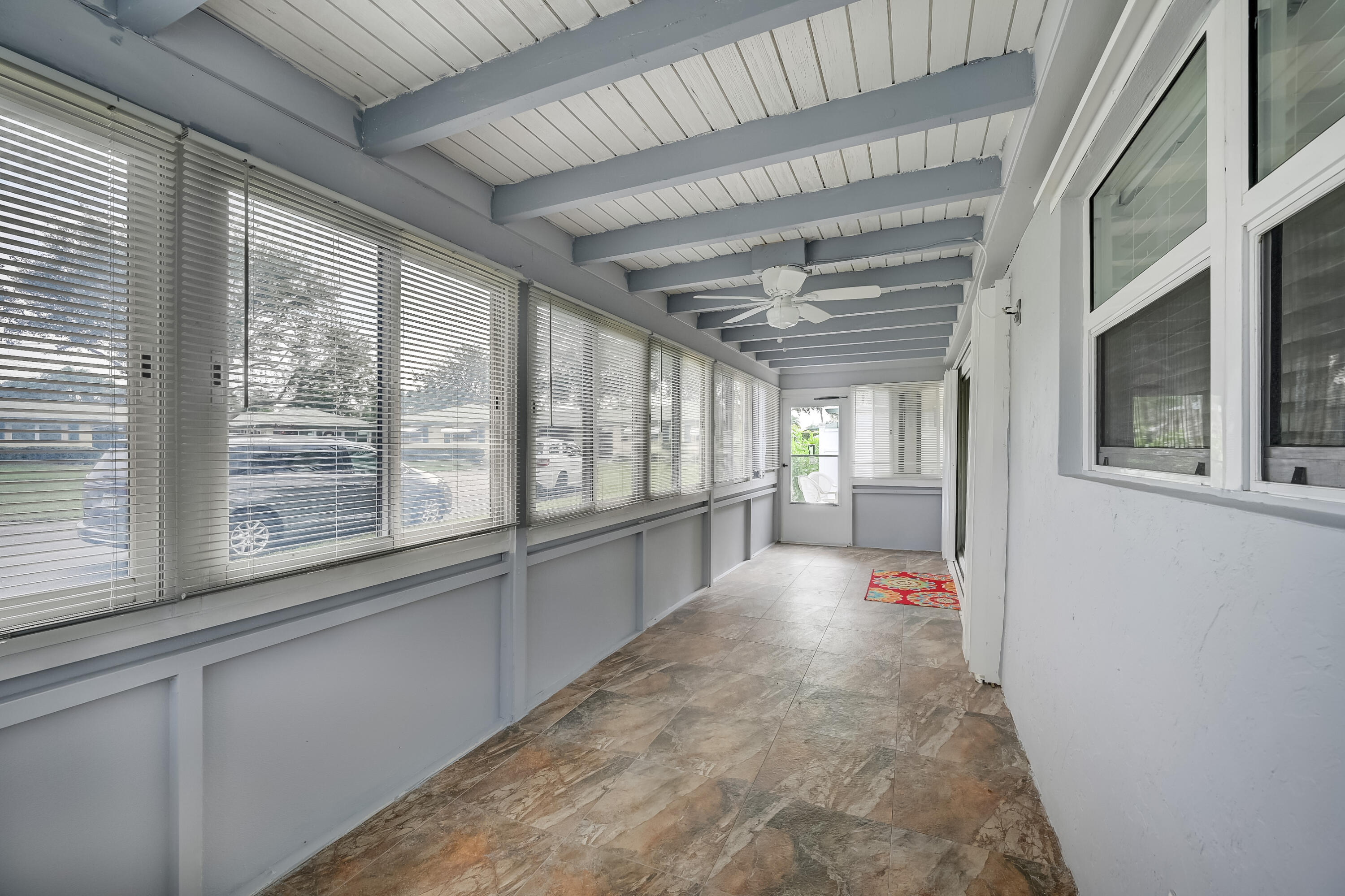 227 Cardinal Lane Delray Beach, FL 33445 - Photo 22 of 38 a view of a hallway with a large window