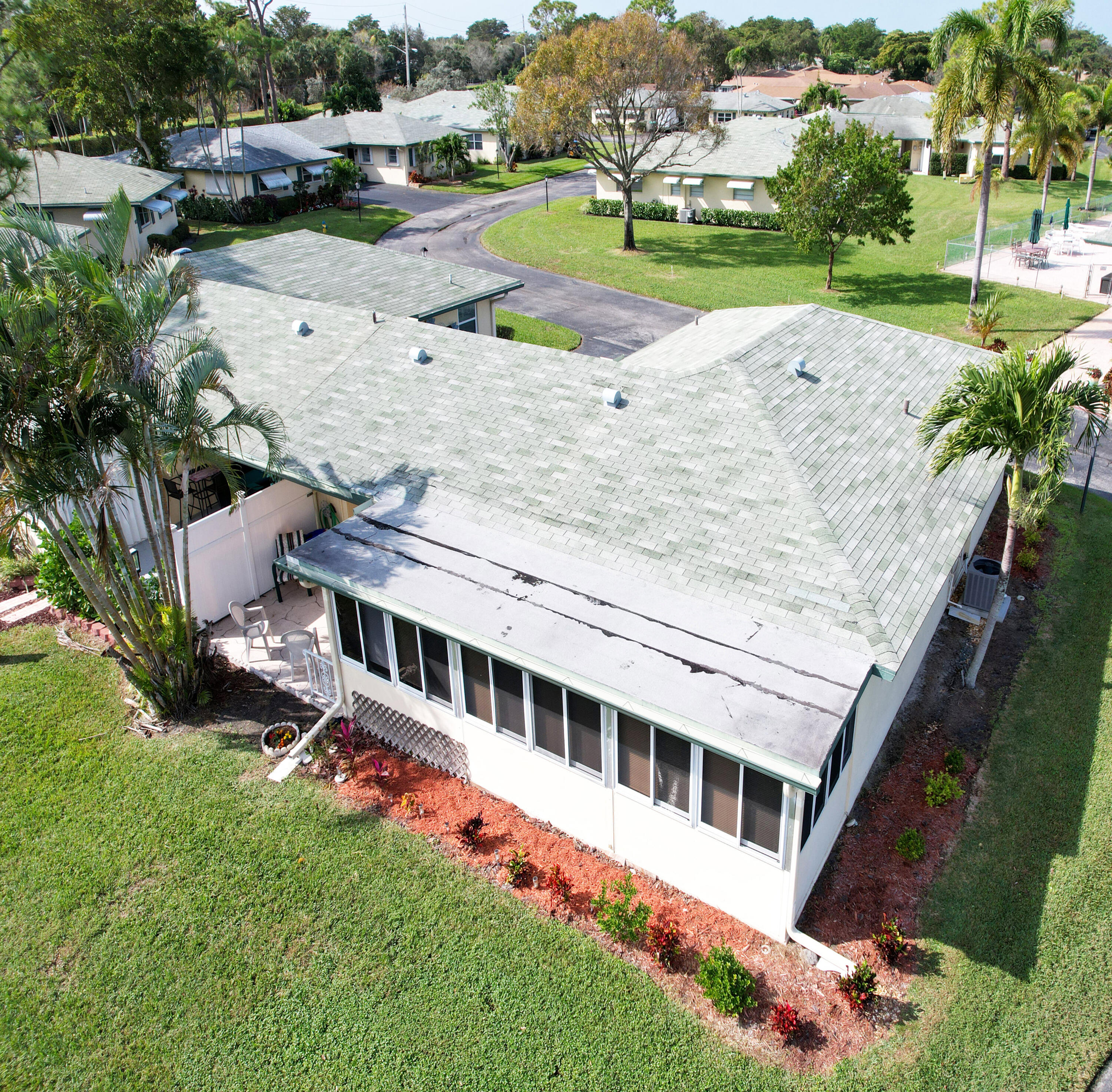 227 Cardinal Lane Delray Beach, FL 33445 - Photo 34 of 38 an aerial view of a house with a yard