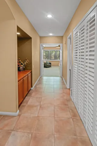 a large bathroom with a sink and mirror