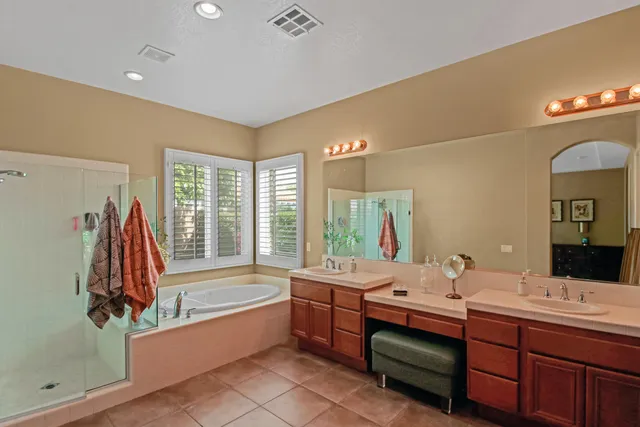 a bathroom with a tub sink and a mirror