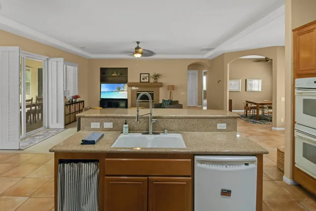 a kitchen with a sink and wooden cabinets