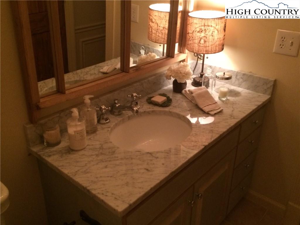 3729 Andy Hicks Road Banner Elk, NC 28604 - Photo 22 of 36 a bathroom with a sink and a mirror