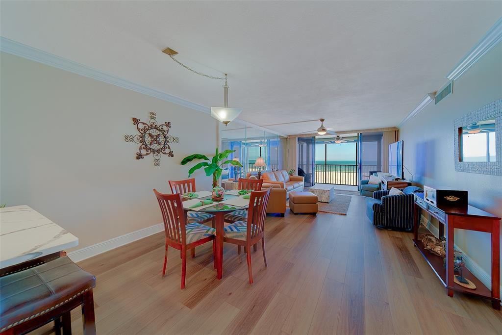 18304 Gulf Boulevard, Unit 102 Redington Shores, FL 33708 - Photo 13 of 55 a living room with furniture and a wooden floor