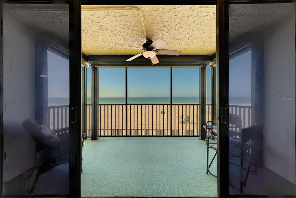 18304 Gulf Boulevard, Unit 102 Redington Shores, FL 33708 - Photo 22 of 55 a picture of a bench in front of a building