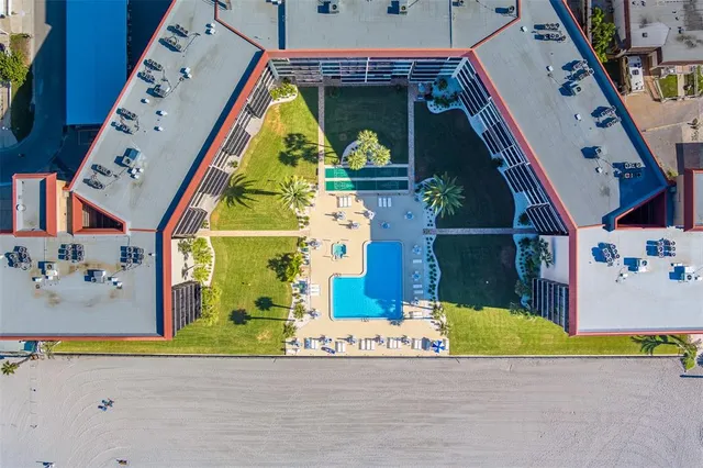 an aerial view of a house with a swimming pool