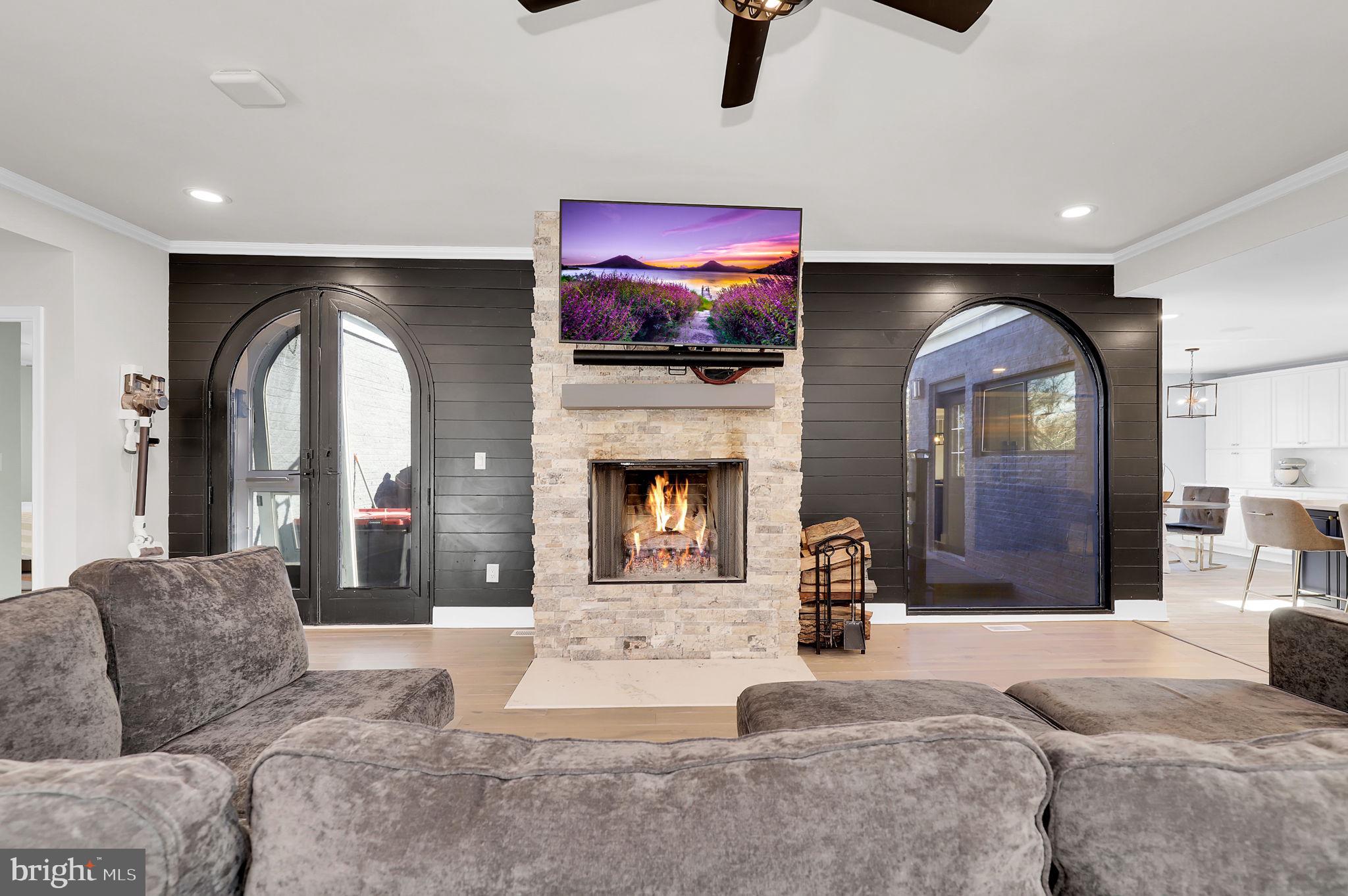 2919 Davidsonville Road Davidsonville, MD 21035 - Photo 16 of 63 a living room with furniture and a fireplace