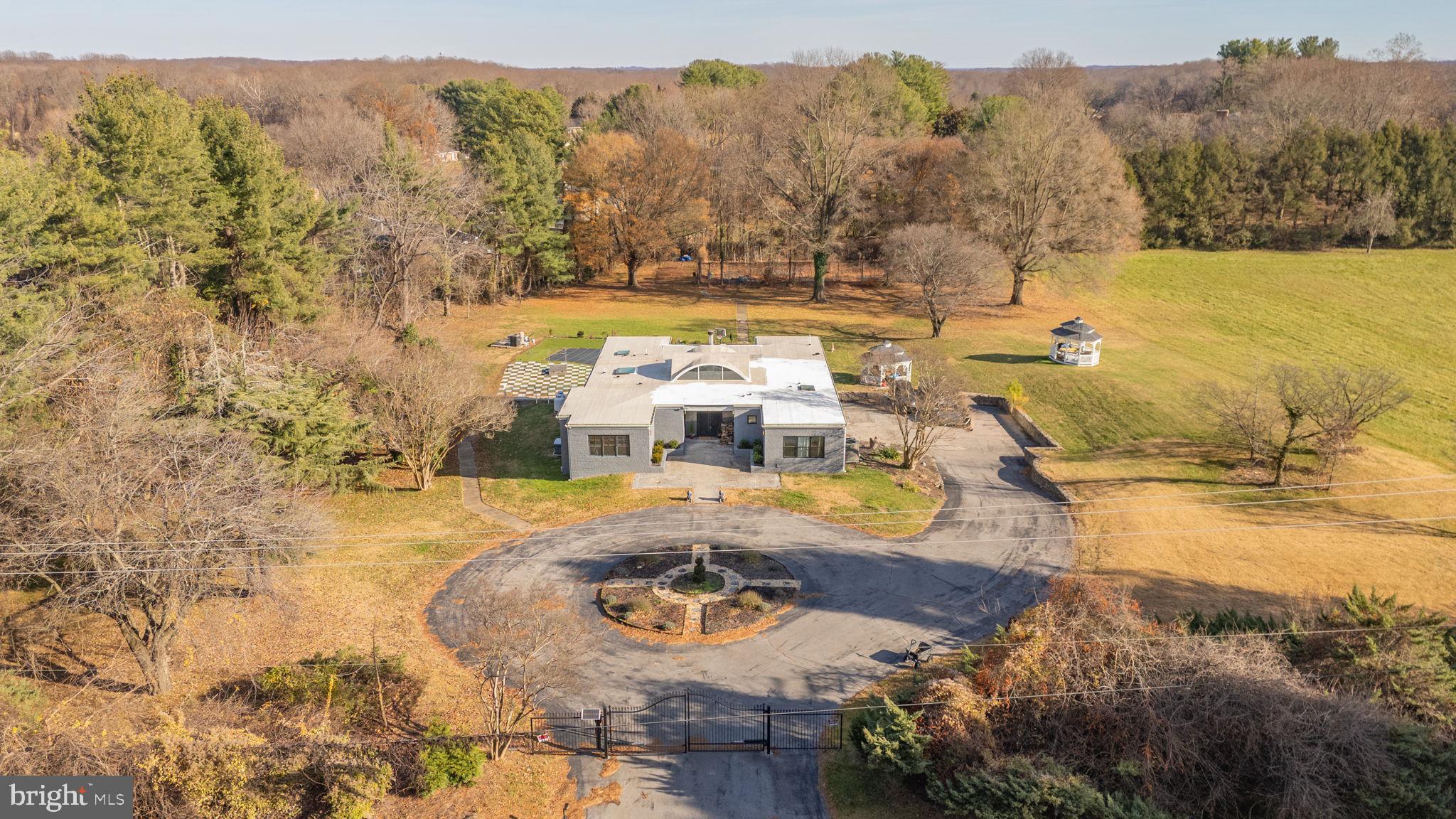 2919 Davidsonville Road Davidsonville, MD 21035 - Photo 2 of 63 a view of a swimming pool with an outdoor seating