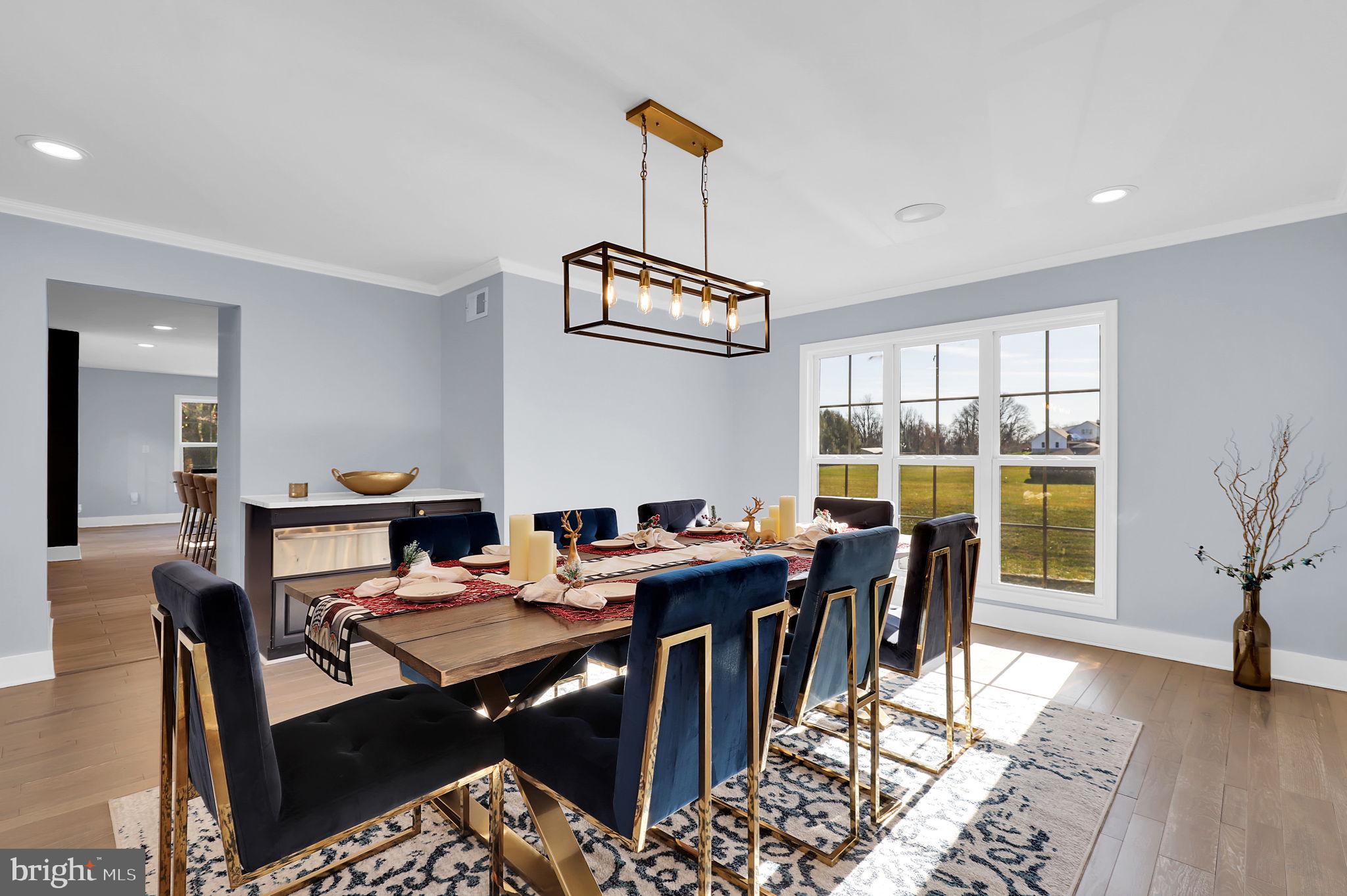2919 Davidsonville Road Davidsonville, MD 21035 - Photo 25 of 63 a view of a dining room with furniture window and wooden floor