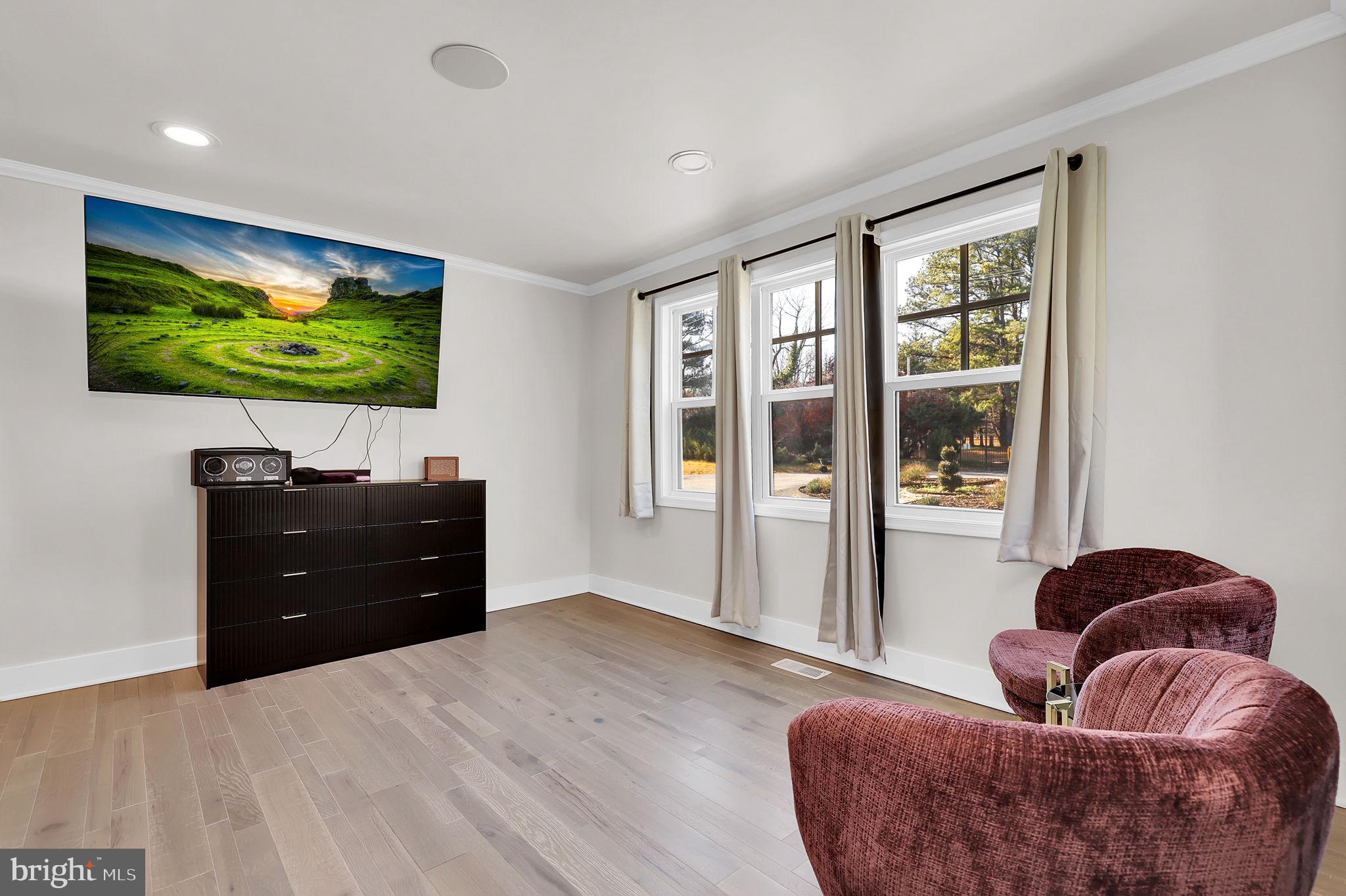 2919 Davidsonville Road Davidsonville, MD 21035 - Photo 28 of 63 a living room with furniture and a flat screen tv