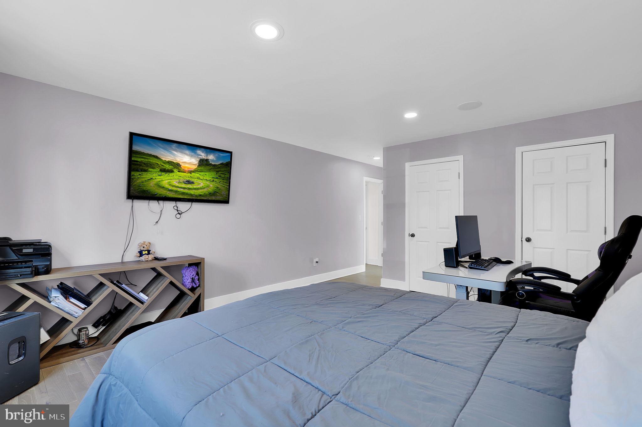 2919 Davidsonville Road Davidsonville, MD 21035 - Photo 34 of 63 a bedroom with a bed and a flat screen tv