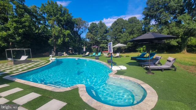 2919 Davidsonville Road Davidsonville, MD 21035 - Photo 63 of 63 a swimming pool with outdoor seating yard barbeque oven and trees