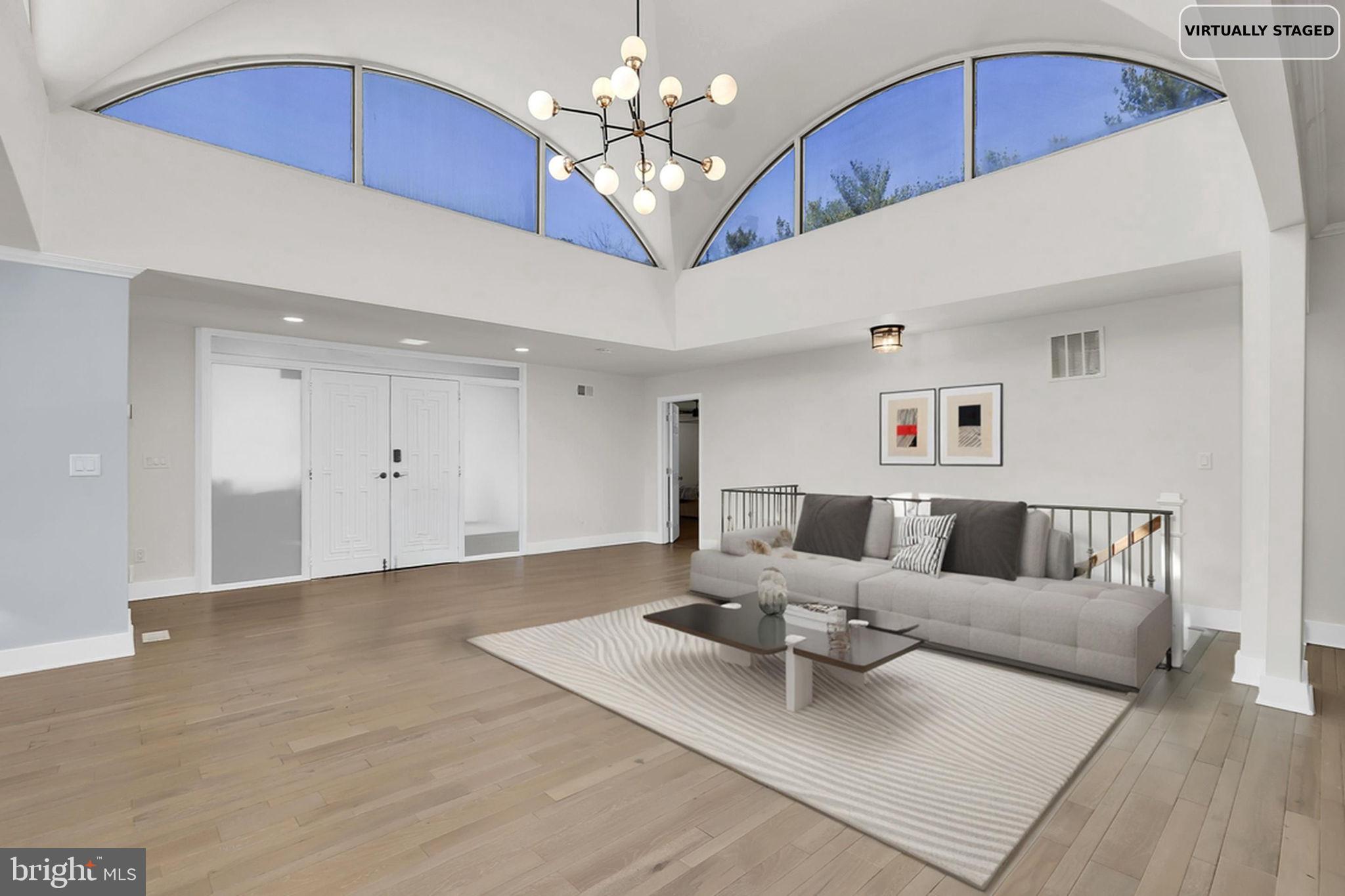 2919 Davidsonville Road Davidsonville, MD 21035 - Photo 9 of 63 a living room with furniture and a chandelier