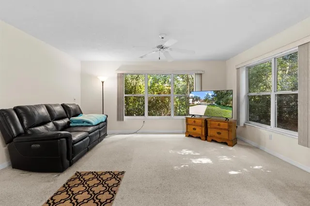 a living room with furniture and a window