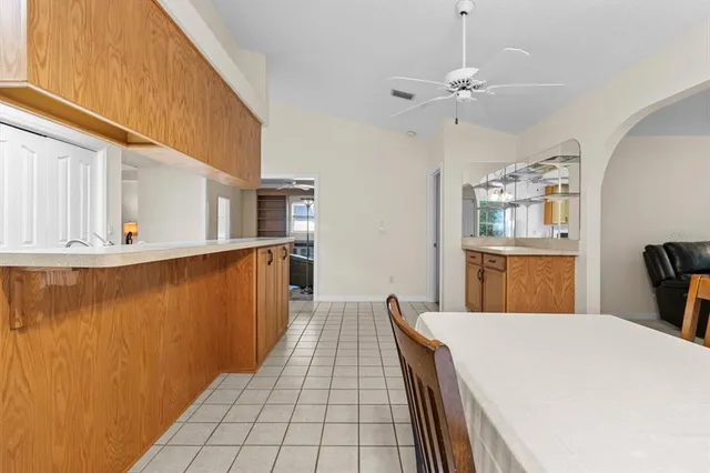 a kitchen with a sink appliances and cabinets
