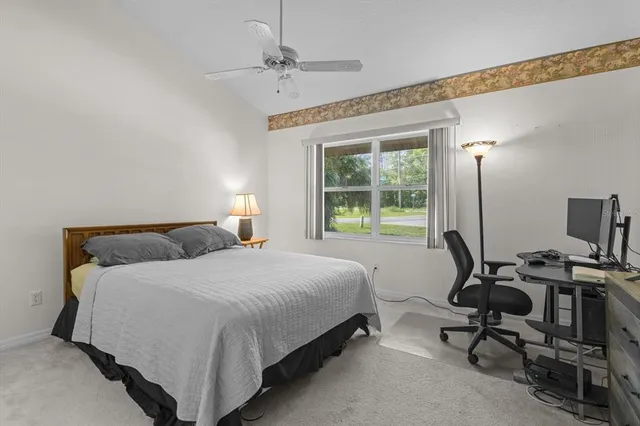 a bedroom with a workspace