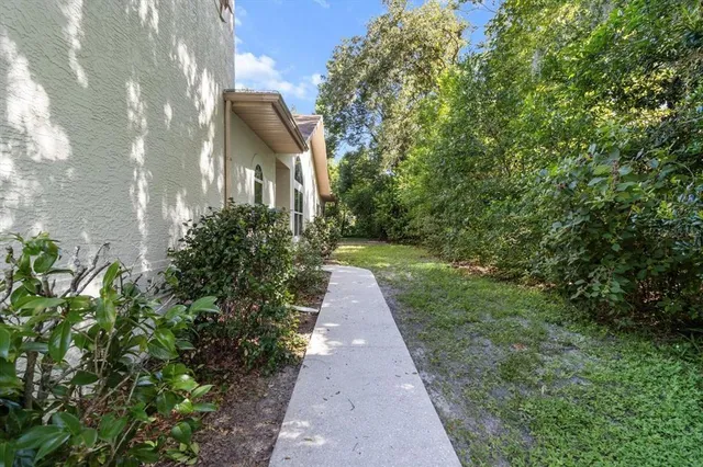 a view of a pathway both side of yard