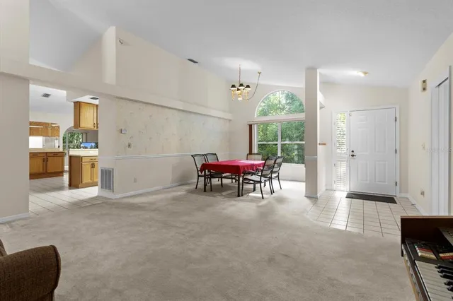 a living room with furniture a window and a table
