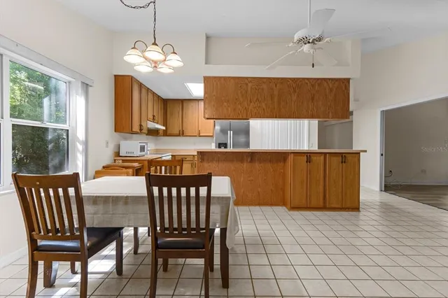 a view of a dining room with furniture and window