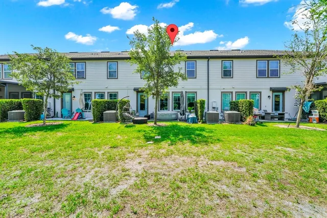 a front view of house with yard and green space