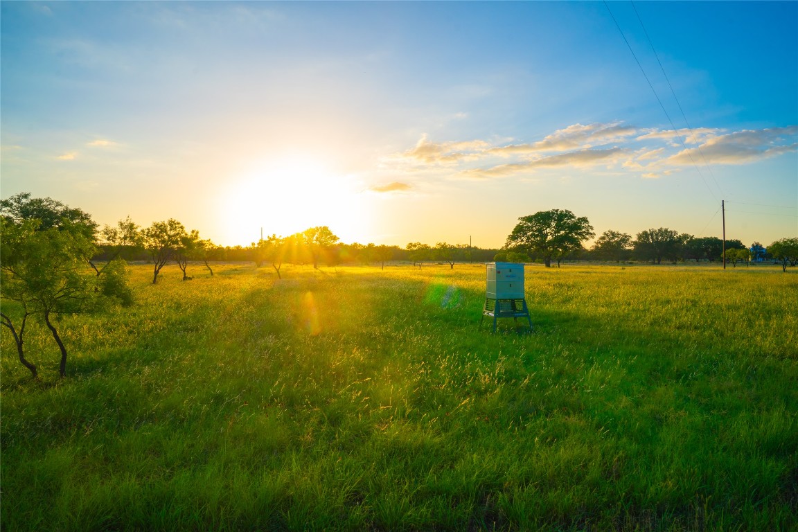 0 Rolling Oaks Ranch Johnson City, TX 78636 - Photo 17 of 30 a view of a lake with houses in the back