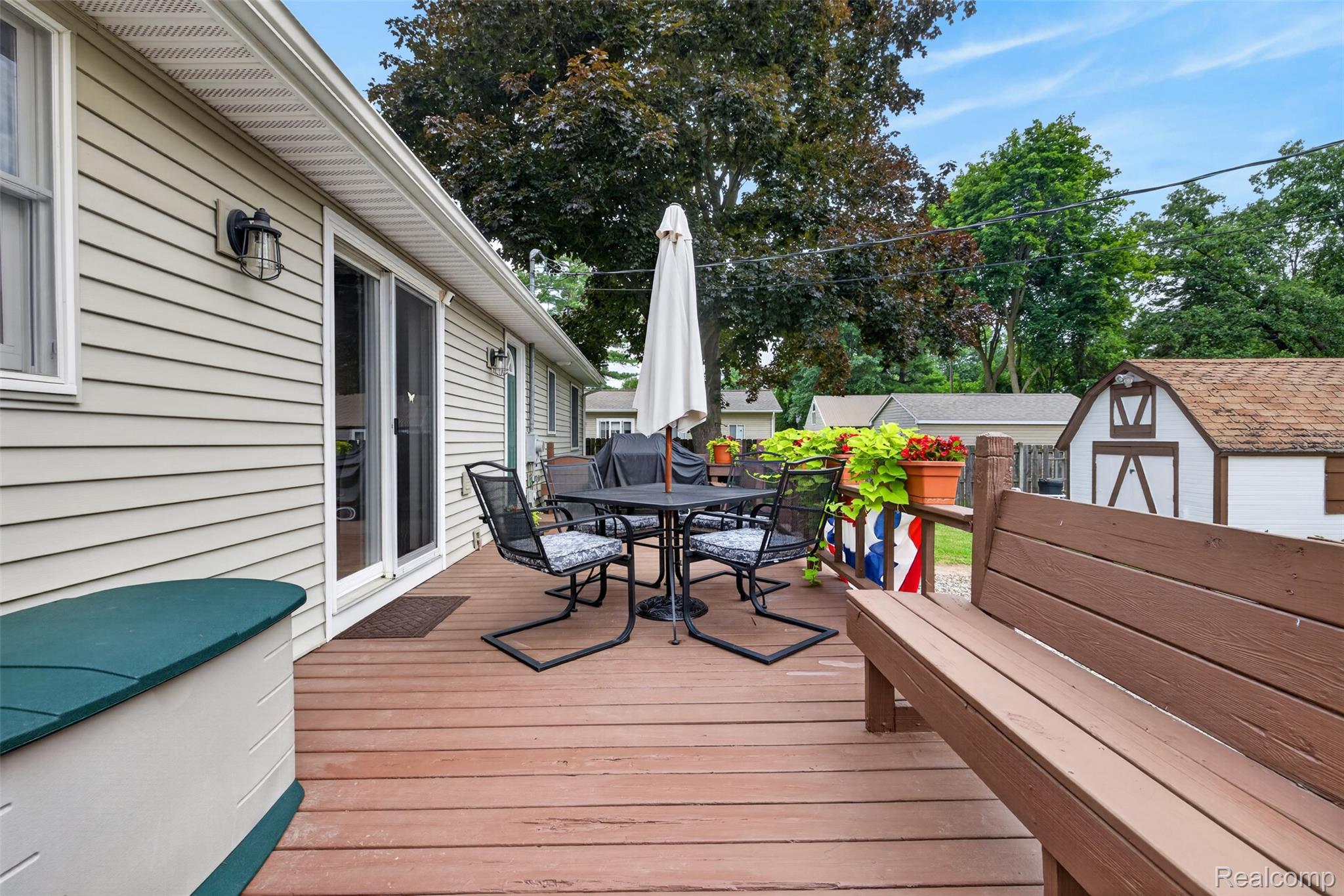 5977 Anglers Road Ortonville, MI 48462 - Photo 61 of 63 Spacious exterior deck featuring wood-finish decking, siding exterior, and sliding glass doors