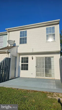 a view of house with backyard