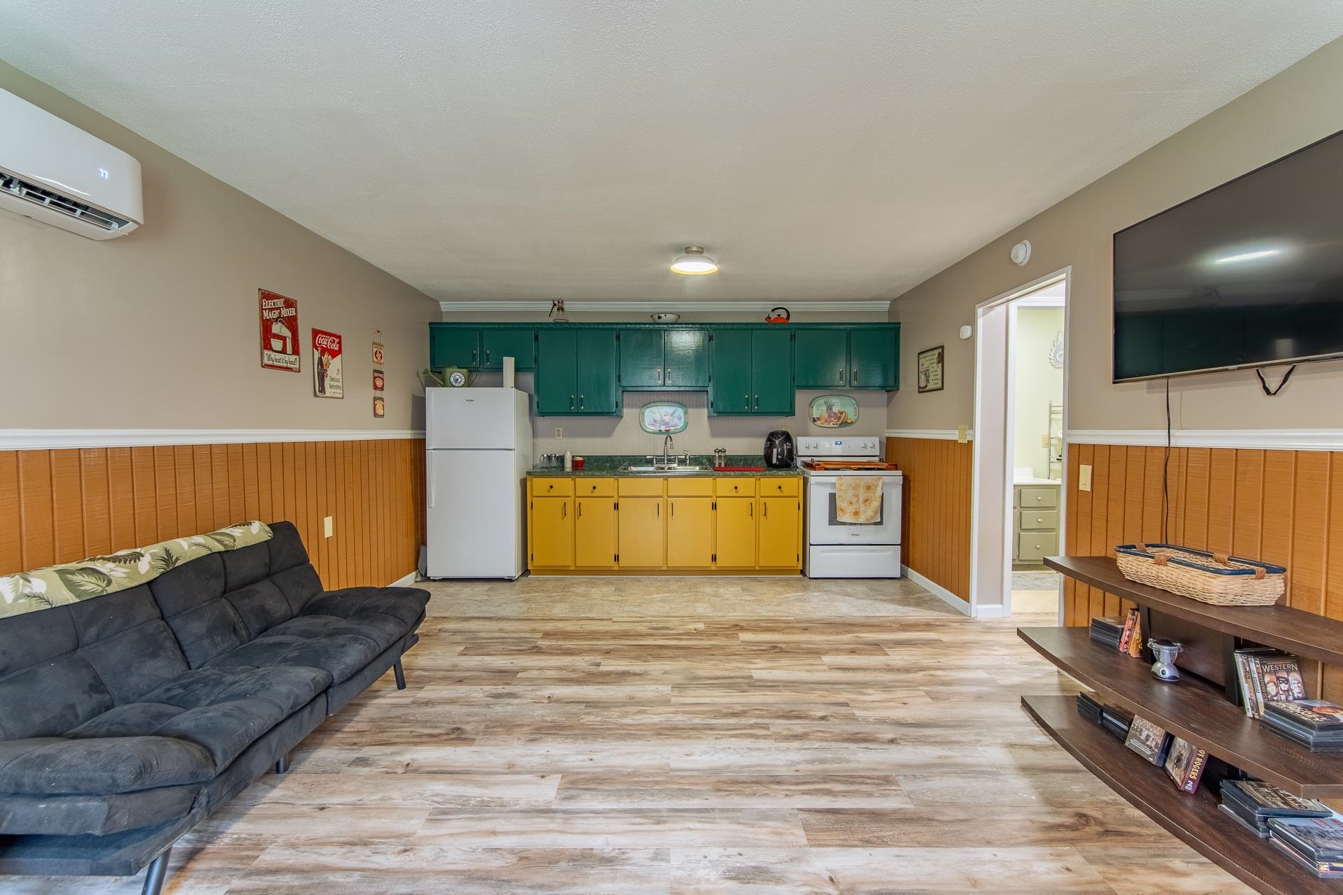 185 Baxter Road Counce, TN 38326 - Photo 39 of 40 a living room with furniture and a flat screen tv