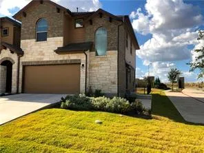 a couple of potted plants in front of door