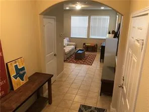 a kitchen with granite countertop a refrigerator a stove and a sink