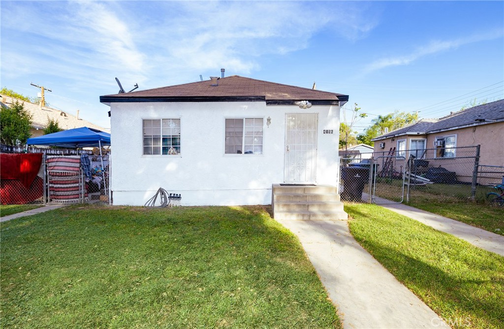 4156 Dwight Avenue Riverside, CA 92507 - Photo 2 of 8 a front view of a house with a yard