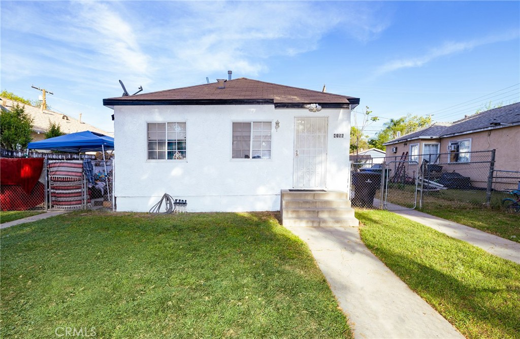 4156 Dwight Avenue Riverside, CA 92507 - Photo 2 of 8 a front view of a house with a yard