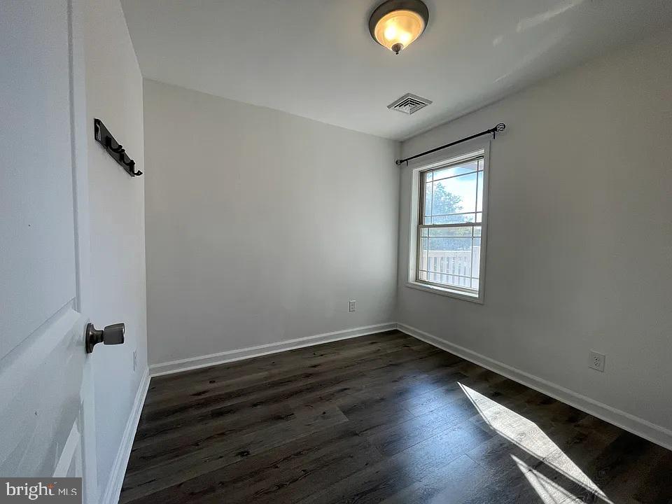 1002 Fairmount Avenue Philadelphia, PA 19123 - Photo 13 of 17 a view of room with window and wooden floor