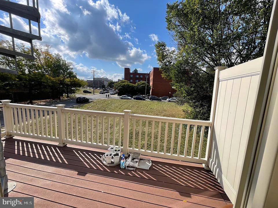 1002 Fairmount Avenue Philadelphia, PA 19123 - Photo 17 of 17 a view of balcony with wooden floor and fence