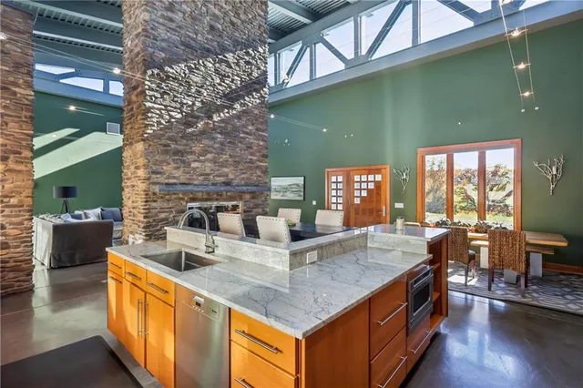 a kitchen with a sink and chandelier
