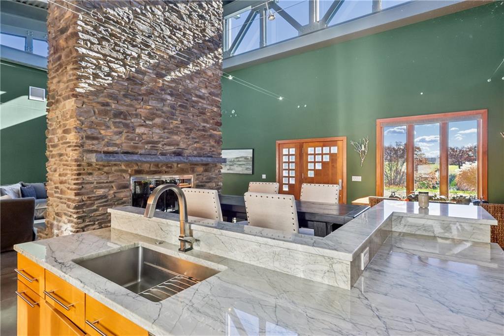 461 Dutchman Run Road New Kensington, PA 15068 - Photo 22 of 50 a kitchen with a sink and chandelier