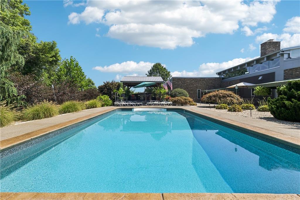 461 Dutchman Run Road New Kensington, PA 15068 - Photo 41 of 50 a view of a swimming pool with an outdoor seating