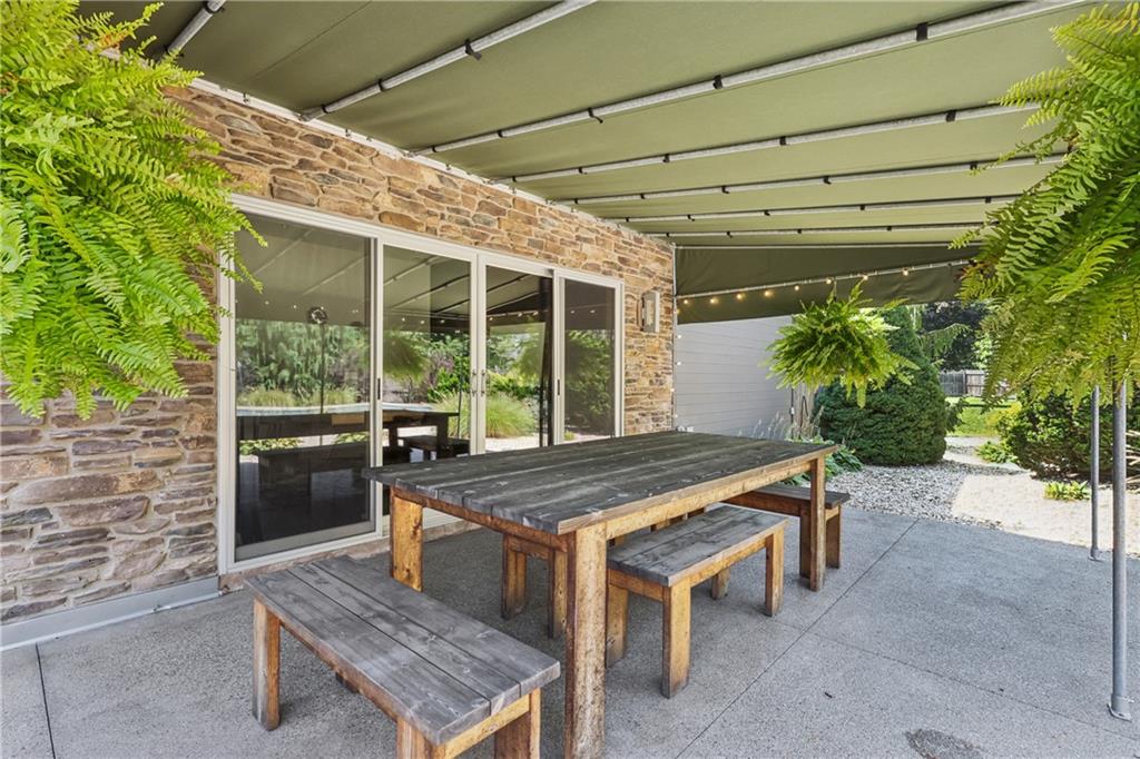 461 Dutchman Run Road New Kensington, PA 15068 - Photo 45 of 50 a view of a patio with a table and chairs in front of it
