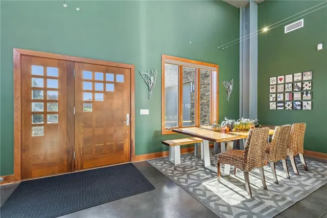 a front view of a house with outdoor seating