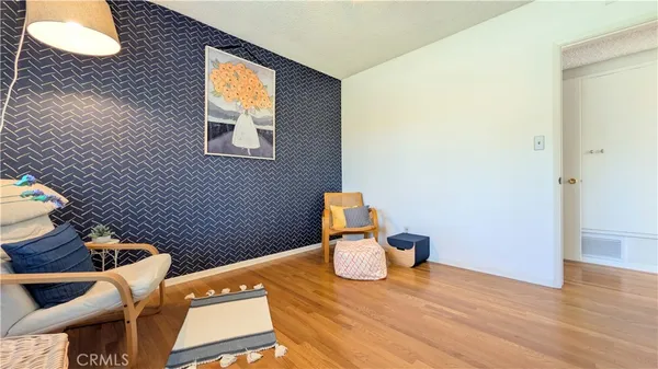 a view of dining room with furniture and wooden floor