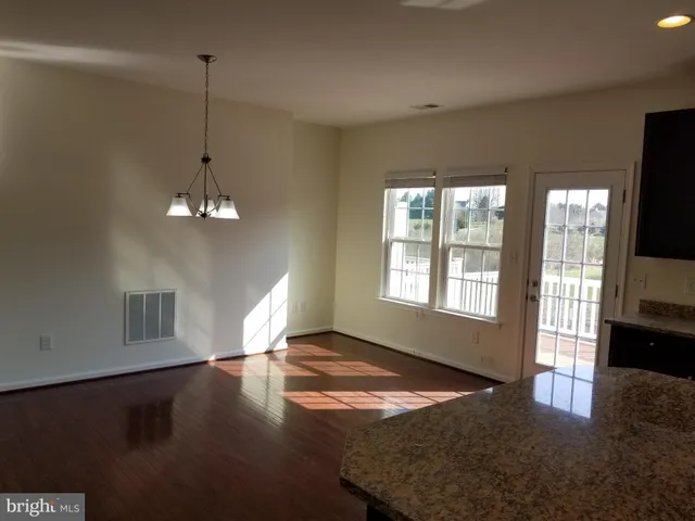 a view of balcony with wooden floor