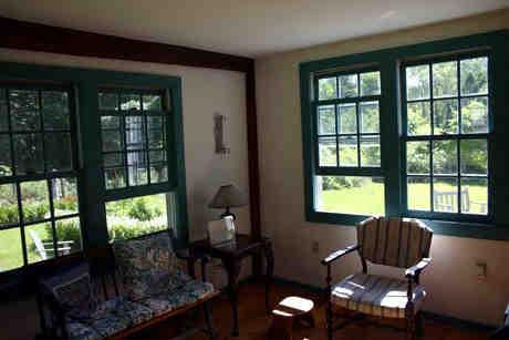 120 Sandisfield Road Sandisfield, MA 01255 - Photo 6 of 8 a living room with furniture and floor to ceiling windows
