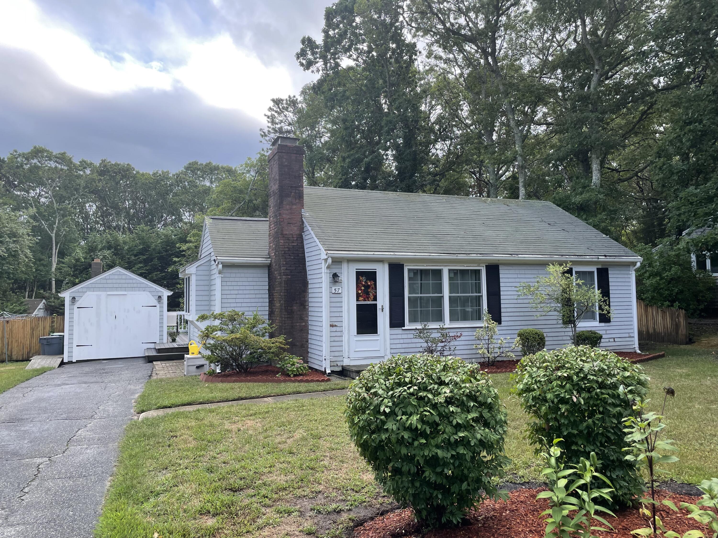 57 Suomi Road Hyannis, MA 02601 - Photo 2 of 11 front view of a house with a yard